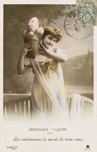 Young woman with a basket full of Easter eggs
