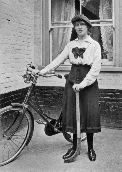 Framed Print : Young woman with bicycle and hockey stick Framed Print : Young woman with bicycle and hockey stick