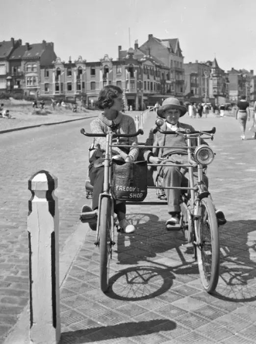 Framed Print : Young woman and boy on two-seater cycle, Bruges, Belgium Framed Print : Young woman and boy on two-seater cycle, Bruges, Belgium