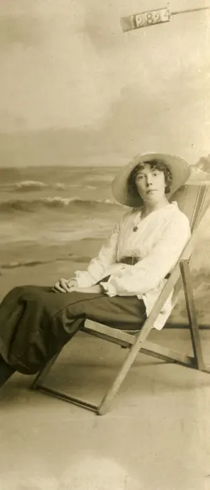 Framed Print : Young woman in a deckchair in a studio photo Framed Print : Young woman in a deckchair in a studio photo