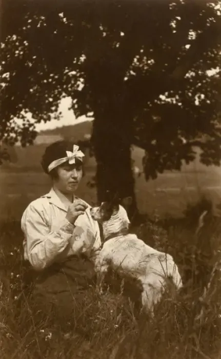 Framed Print : Young woman and dog in field Framed Print : Young woman and dog in field