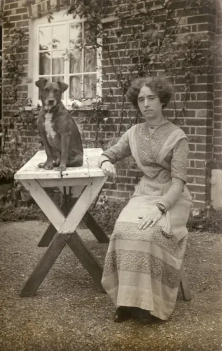 Framed Print : Young woman and dog in garden Framed Print : Young woman and dog in garden