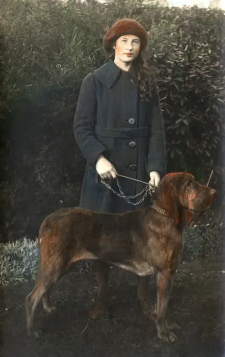 Framed Print : Young woman with a dog in a garden Framed Print : Young woman with a dog in a garden