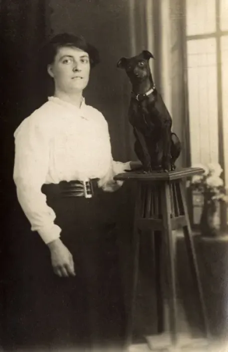 Framed Print : Young woman with dog on pedestal Framed Print : Young woman with dog on pedestal