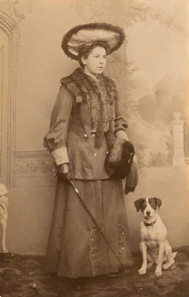 Young woman with dog in studio photo