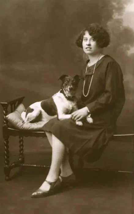 Framed Print : Young woman with dog in studio photo Framed Print : Young woman with dog in studio photo