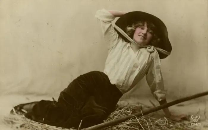 Framed Print : Young woman in a large hat sitting on straw Framed Print : Young woman in a large hat sitting on straw