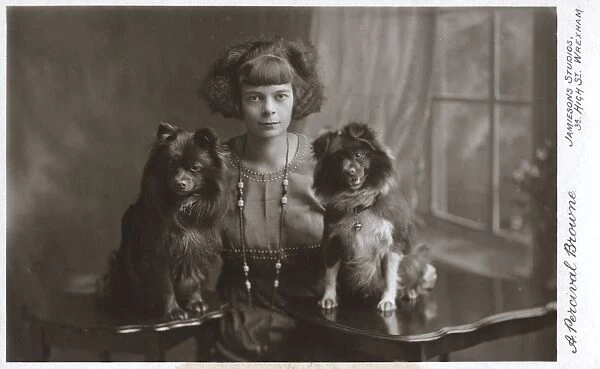 Young woman with two little dogs