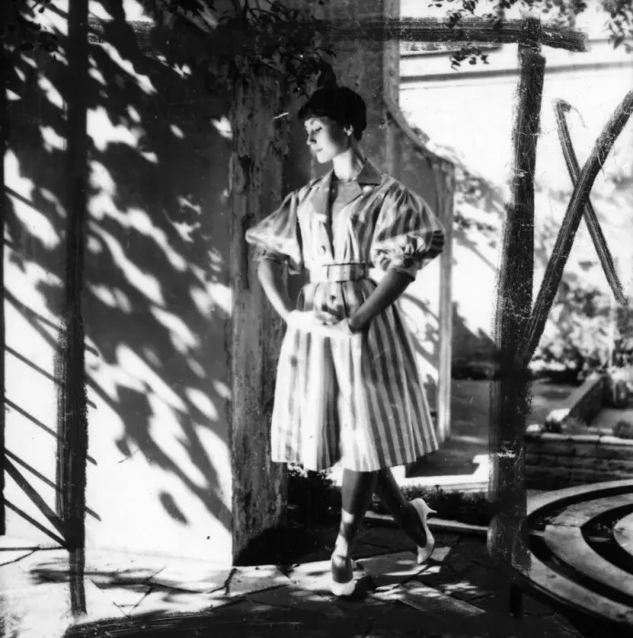 Framed Print : Young woman modelling a dress in a garden Framed Print : Young woman modelling a dress in a garden