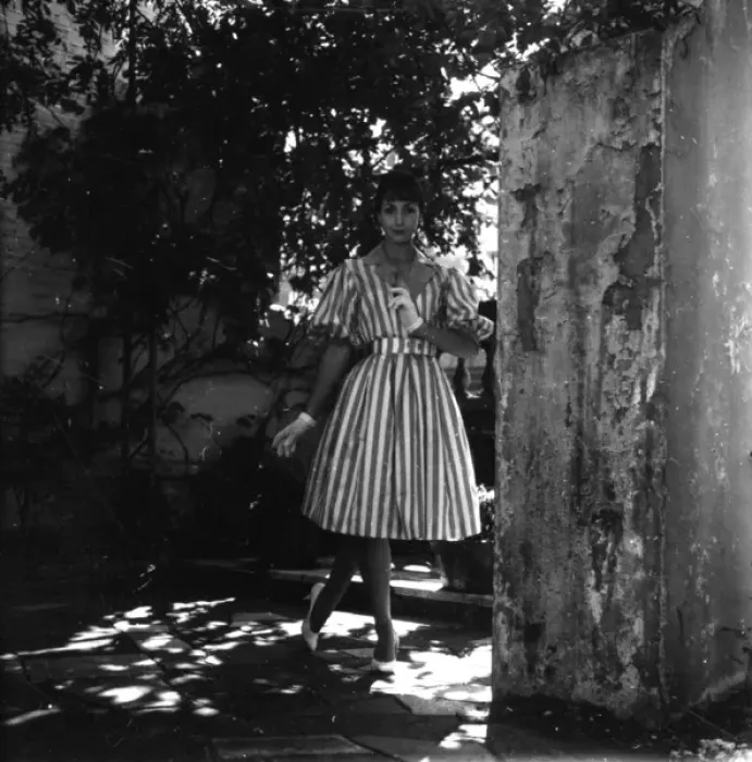 Framed Print : Young woman modelling a dress in a garden Framed Print : Young woman modelling a dress in a garden