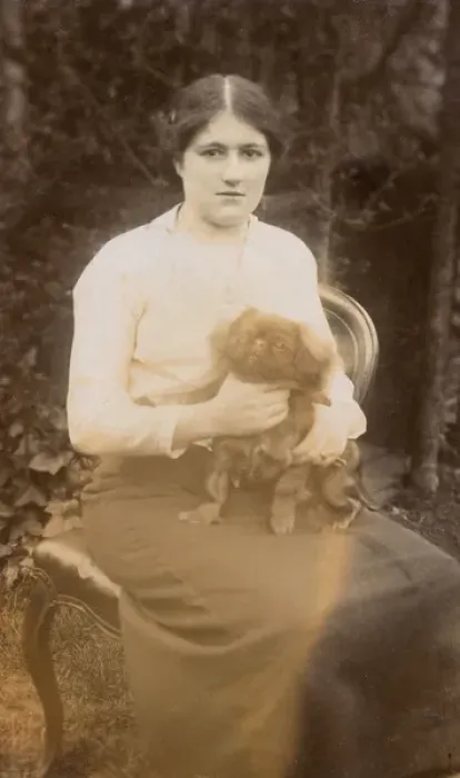 Framed Print : Young woman with Pekingese dog in a garden Framed Print : Young woman with Pekingese dog in a garden