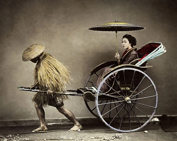 Young woman in rickshaw, Japan