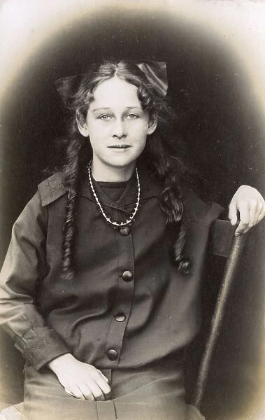 Young woman with ringlets and bow, USA