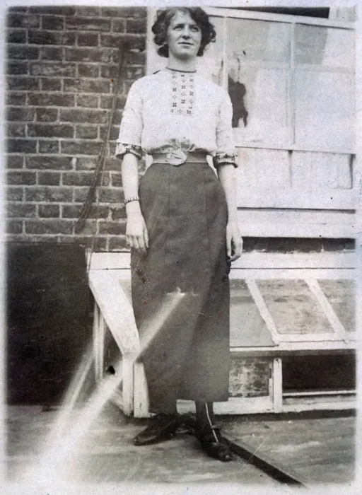 Framed Print : Young woman standing outside her home Framed Print : Young woman standing outside her home