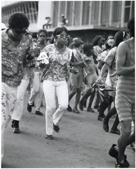 Framed Print : A young woman in trendy sunglasses dances with her friends at the Port of Spain Carnival, Trinidad, West Indies. Date: 1968 Framed Print : A young woman in trendy sunglasses dances with her friends at the Port of Spain Carnival, Trinidad, West Indies. Date: 1968