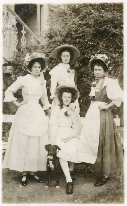 Framed Print : Four young women and a dog in a garden Framed Print : Four young women and a dog in a garden
