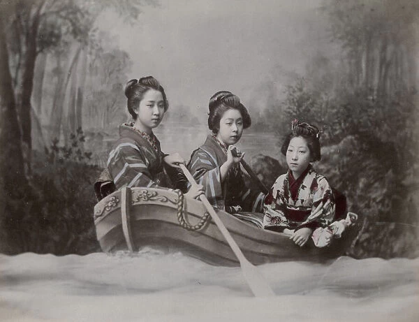 Young women in a rowing boat, studio scene tableau
