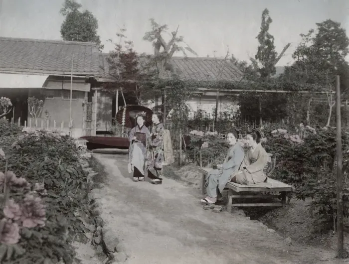 Framed Print : Young women sitting in a flower garden, Japan Framed Print : Young women sitting in a flower garden, Japan