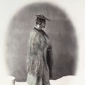 1860s Japan - portrait of a man in a straw rain coat Felice or Felix Beato