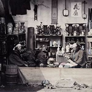 1860s Japan - portrait of a two people at a curio or souvenir stall Felice or Felix