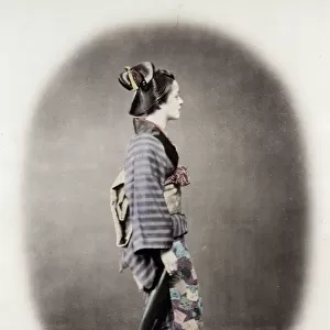 1860s Japan - portrait of a young woman in an ornate kimono
