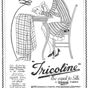 Advert for Tricoline artificial silk fabric, with illustration of a young woman studying a dress pattern with her fabric laid out ready for cutting. Date: 1920s Advert for Tricoline artificial silk fabric, with illustration of a young woman studying a dress pattern with her fabric laid out ready for cutting. Date: 1920s