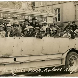 Adults and children in a large charabanc, Rhyl, North Wales