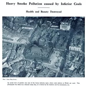 Aerial view of a city with heavy smoke pollution