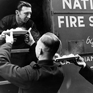 AFS firefighters being served from mobile kitchen, WW2