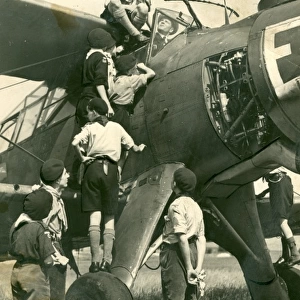 Air Scouts climbing on plane with Lord Olivier