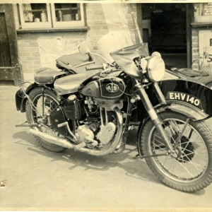 AJS / A J Stevens British Motorcycle & Sidecar at a Garage, En