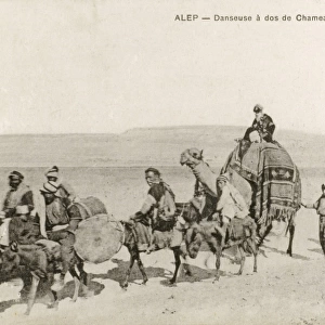 Aleppo, Syria - Dancer travelling by Camel