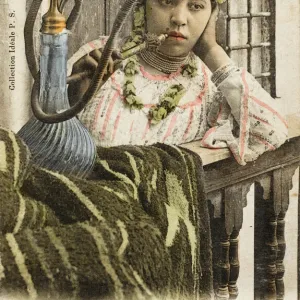 Algeria - Woman smoking a nargile pipe