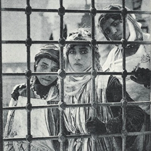 Three Algerian Girls looking in through the window