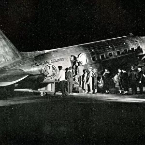 American Airlines passengers boarding a night flight