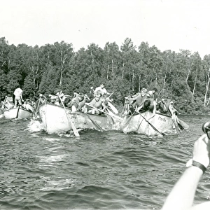 American Scouts paddling boats