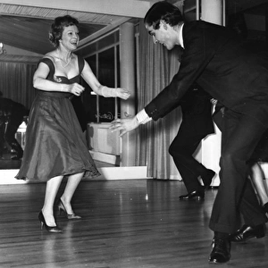 Anna Neagle dancing the twist with Grenville Collins