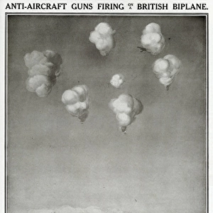 Anti-aircraft guns firing on British biplane, 1914