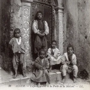 Arab children in a house doorway, Algiers, Algeria