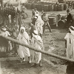 Arabs and others with oil barrels