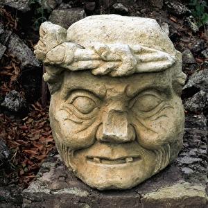 Archaeological Site of Copan. Stone head of an old man. Hond