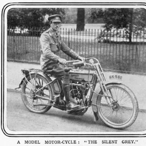 An army officer sits astride a Silent Grey Harley Davidson