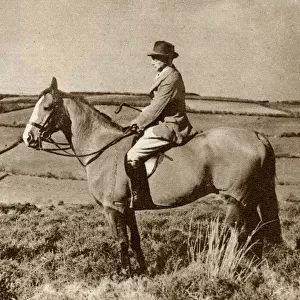 The artist, Alfred Munnings, riding a horse in Somerset