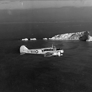 Avro Anson I MK614 of the Royal Navy flies past the Needles