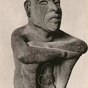 Aztec statue of a seated man - fire deity Huehueteotl
