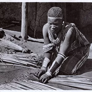 A Basotho woman making mats - South Africa