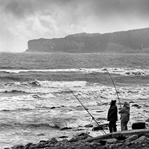 Two beach fishermen with their rods and line
