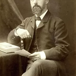 Bearded man in cabinet photograph