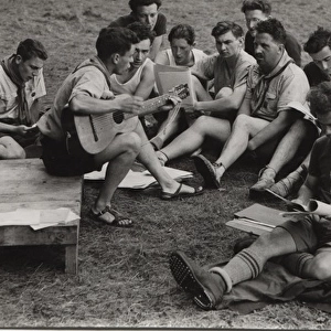 Belgian or French boy scouts singing at camp