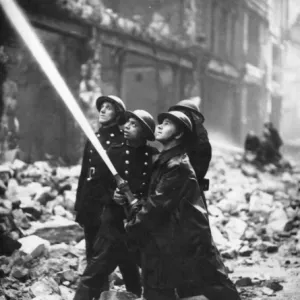 Blitz in London -- firefighters in action with hose, WW2